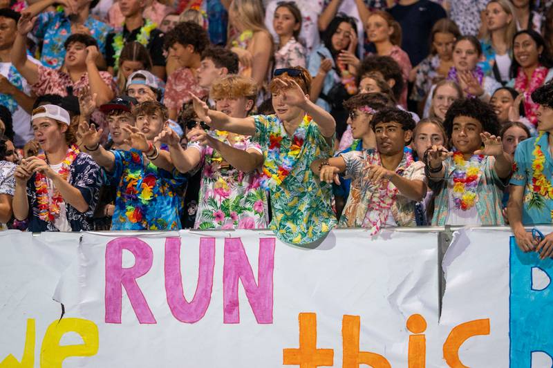 Oswego East fans cheer on their team against Waubonsie Valley during a football game at Waubonsie Valley High School in Aurora on Friday, Aug. 25, 2023.