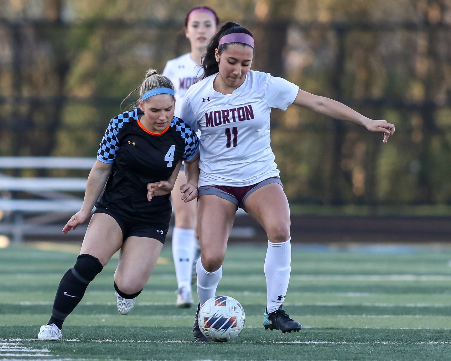 Willowbrook's Lillian Macias (4) battles Morton's Emily orduna (11) for possession during soccer match between Morton at Willowbrook.  April 15, 2024.