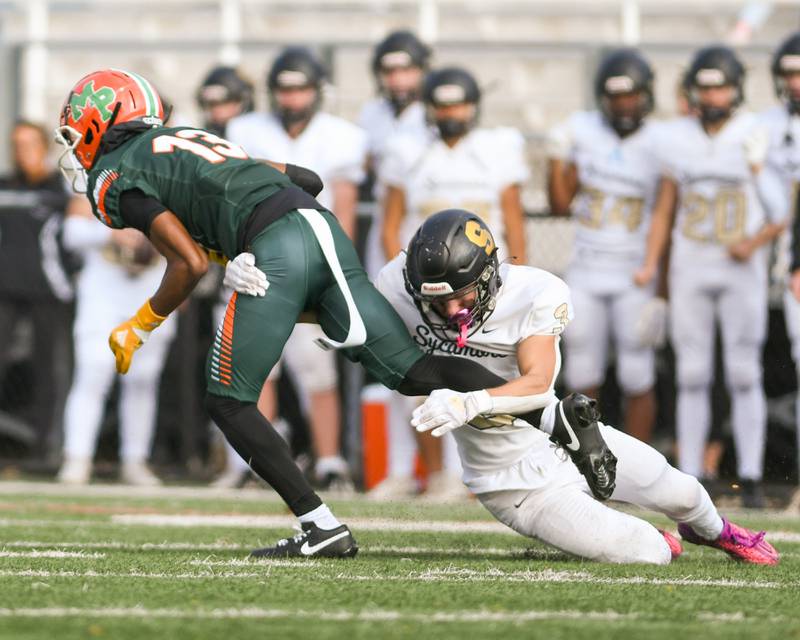 Sycamore Carter York (3) takes down Morgan Park Chris Durr (13) during the second quarter on Saturday Nov. 4, 2023, at Gately Stadium in Chicago.