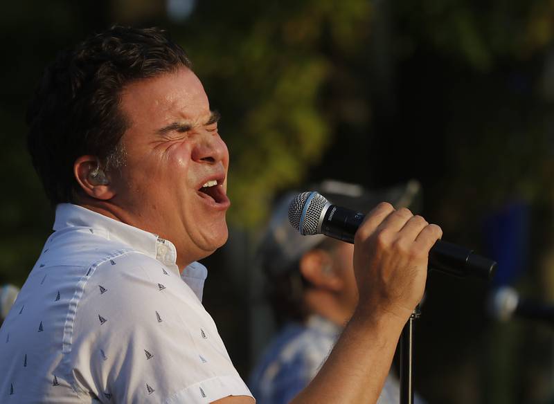 Lead singer Dave Calzaretta of One of These Nights, an Eagles tribute band, sings a song on Tuesday, Aug. 8 2023, during Huntley’s weekly Concert on the Square.
