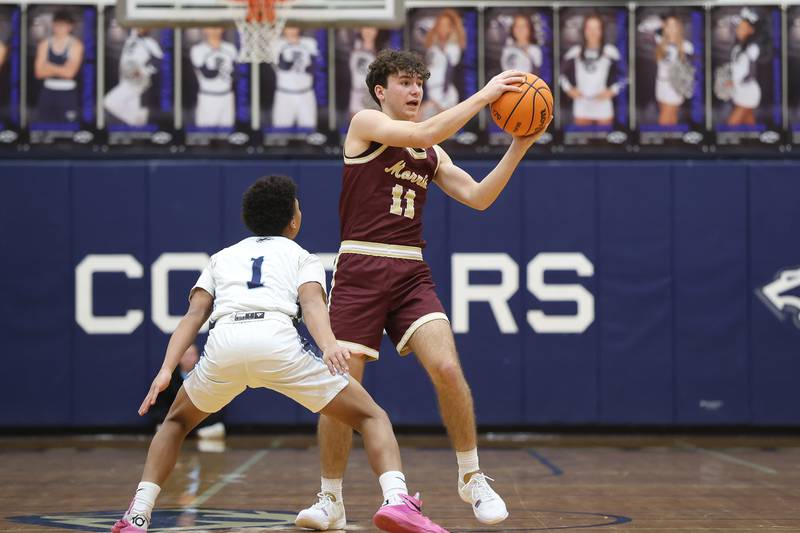 Morris’ Brycen Johnson looks for a play against Plainfield South on Wednesday, Jan. 28, 2026 in Plainfield.