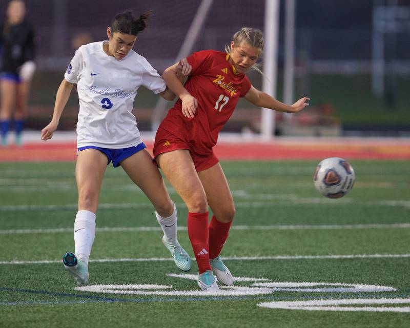 St. Charles North's Aubri Magana battles for the ball against Batavia's Averie Layman on Thursday, April 17,2025 in Batavia.
