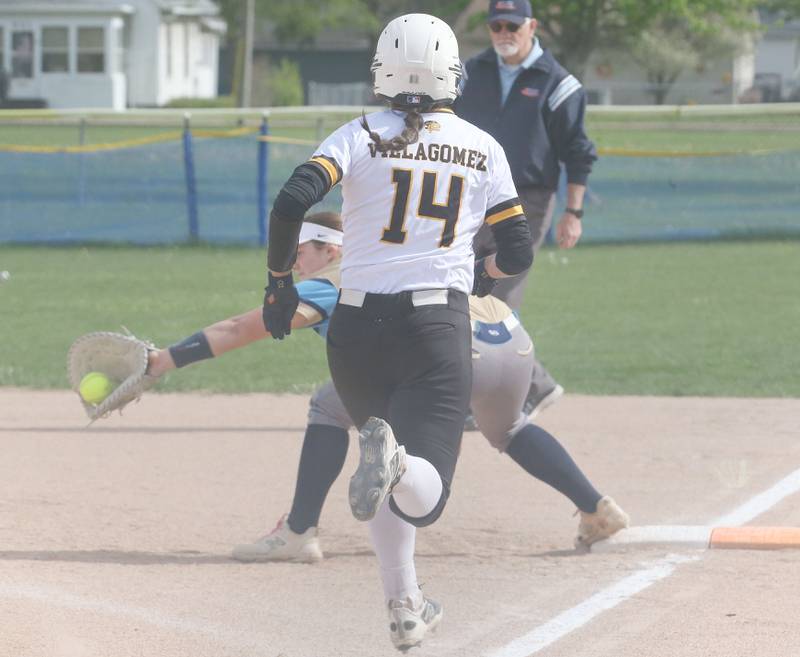 Marquette's Taylor Cuchra squeezes the glove to force out Putnam County's Valeria Villagomez at first base on Tuesday, April 29, 2025 in Ottawa.