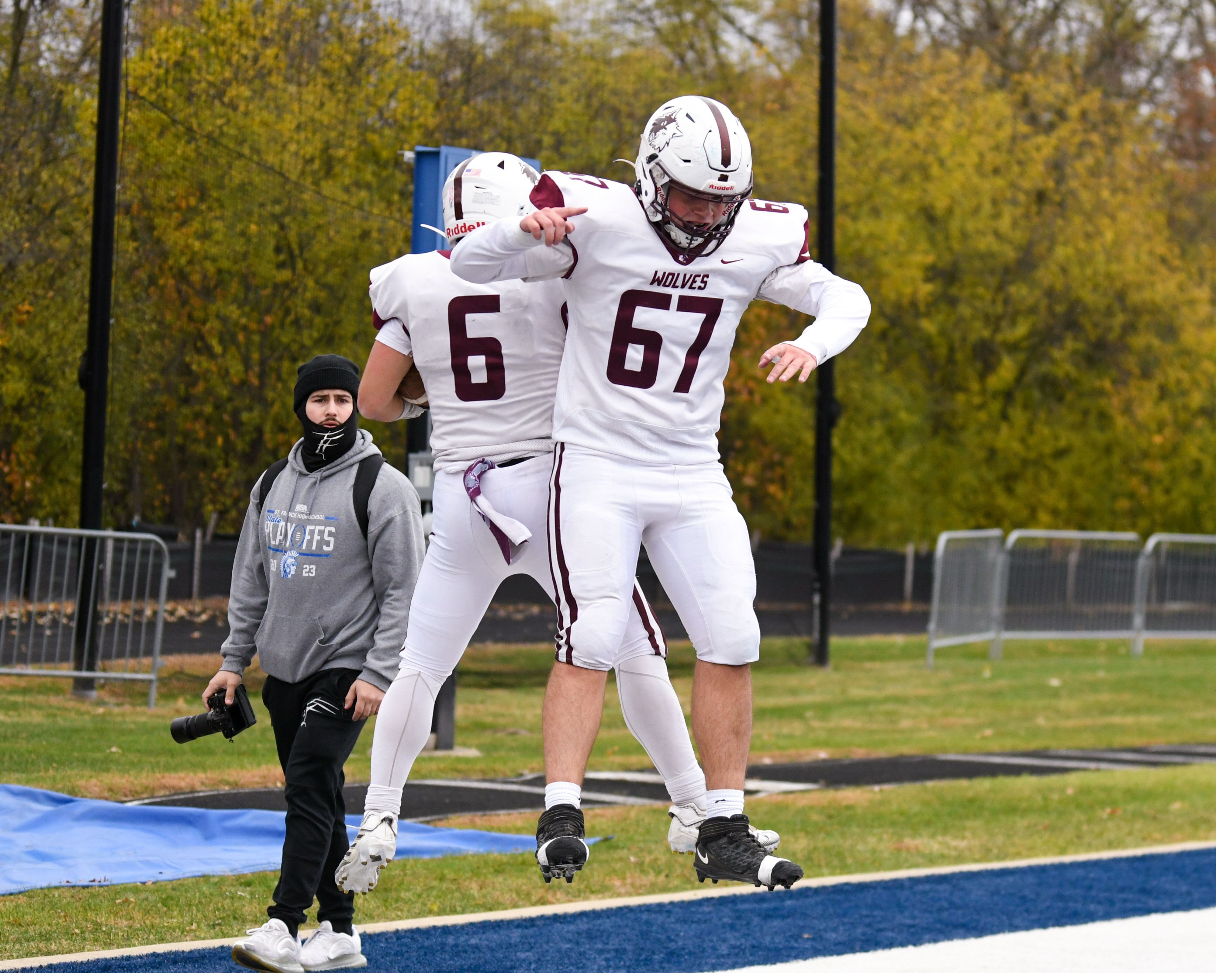 Prairie Ridge's Luke Vanderwiel (6) celebrates his touchdown with teammate Michael Pochron (67) on Saturday Nov. 8, 2025, while taking on St. Francis during the second round of the 5A playoff game held at St. Francis's High School.