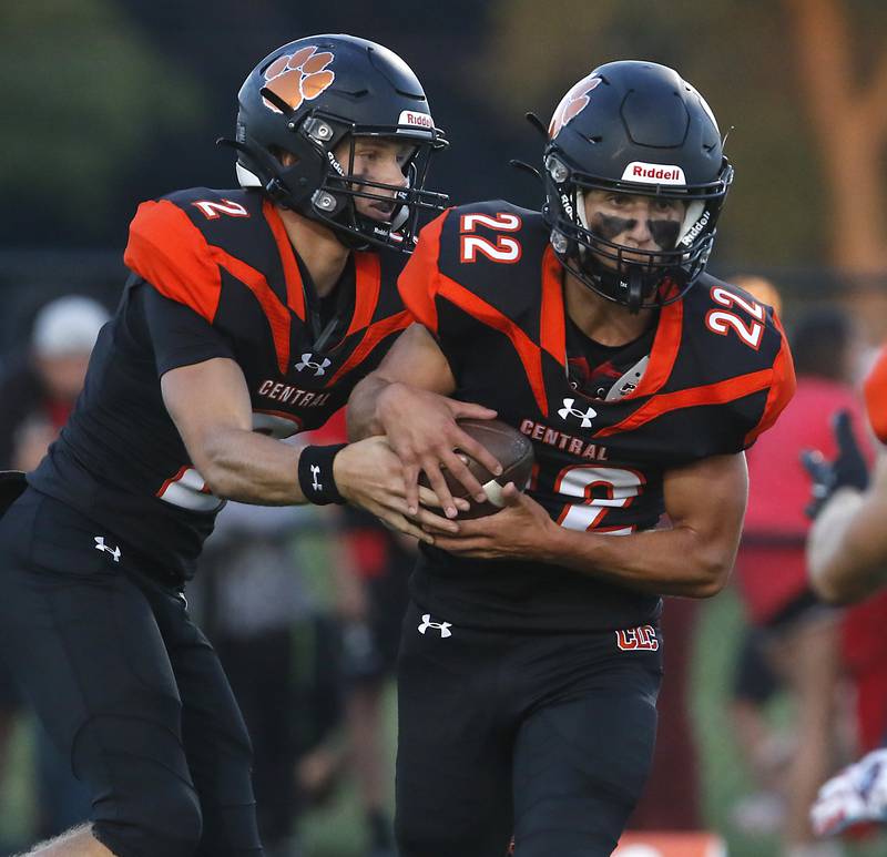 Crystal Lake Central's Jason Penza fakes a handoff to Vince Honer during a Fox Valley Conference football game Friday, Aug. 26, 2022, between Crystal Lake Central and Huntley at Crystal Lake Central High School.