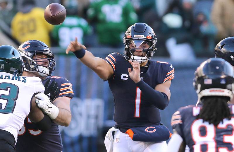 Chicago Bears quarterback Justin Fields throws a pass over Philadelphia Eagles defensive tackle Milton Williams during their game Sunday, Dec. 18, 2022, at Soldier Field in Chicago.