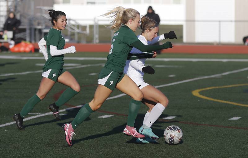 Huntley's Maddie Cummings takes a run towards the goal as Boylan Catholic's Gracie Rose tries to knock her off the ball during a nonconference soccer game on Wednesday, March 27, 2024, at Huntley High School.