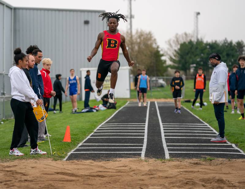 Batavia’s AJ Sanders competes in the long jump during the Roger Wilcox Track and Field Invitational at Oswego High School on Friday, April 29, 2022.