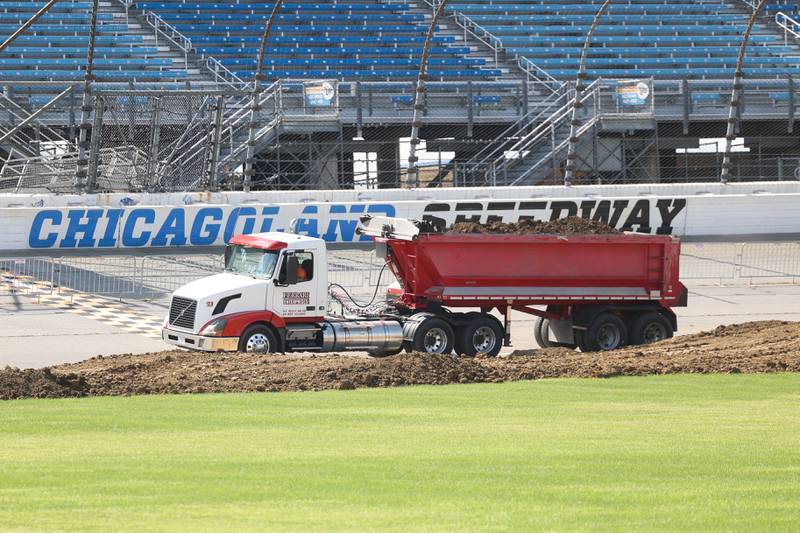 A truck brings in dirt on Tuesday for the motocross course at the Chicagoland Speedway as crew setup for Saturday’s SuperMotocross World Championship Finals in Joliet.
