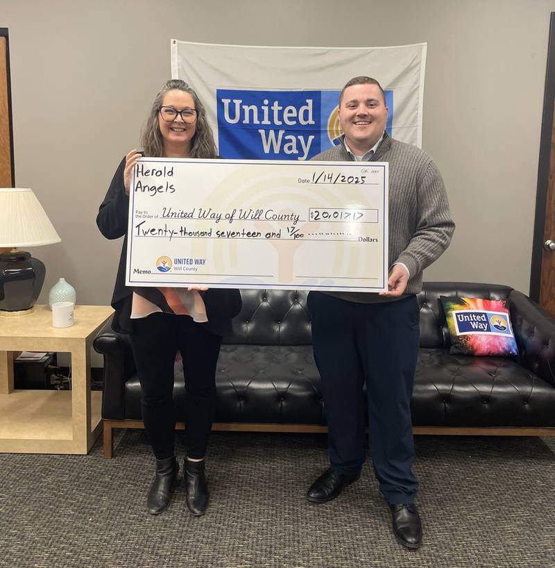 Sarah Oprzedek, president chief executive officer of United Way of Will County (left) and Ken Guldenbecker, development director at United Way of Will County (right), display a check for $20,017 from The Herald-News in Joliet's annual Herald Angels campaign. The 2024 campaign was another record-breaking amount and was the first time donations from the community exceeded $20,000.