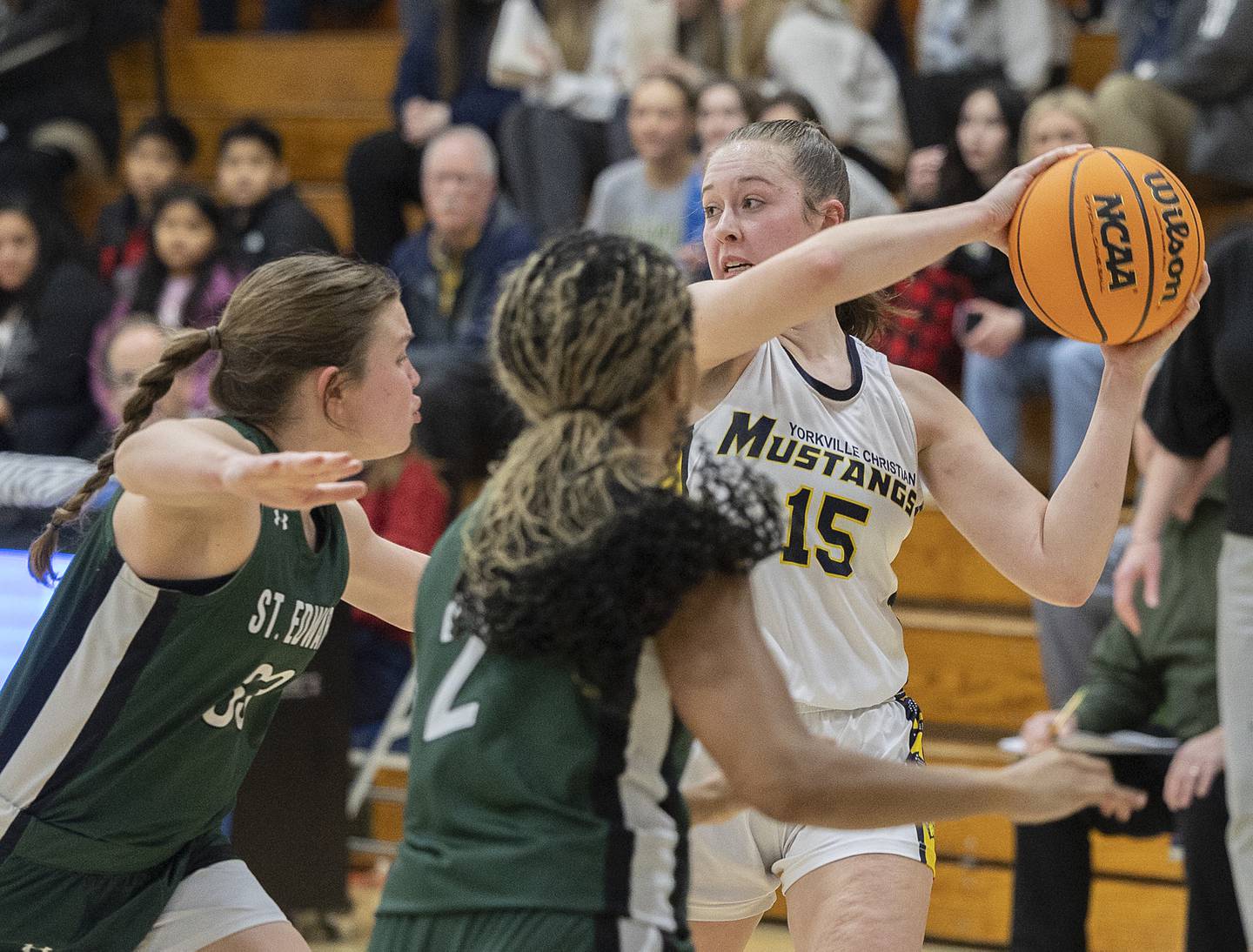 Yorkville Christian’s Payton Wallin looks to pass from the St. Edward’s defense Tuesday, Feb. 25, 2025, in the Class 1A Sectional at Hinckley-Big Rock.