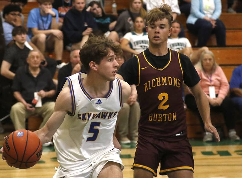 Johnsburg's Kyle Patterson looks to pass the ball as he is guarded by Richmond-Burton's Maddox Meyer during the boy’s game of McHenry County Area All-Star Basketball Extravaganza on Sunday, April 14, 2024, at Alden-Hebron’s Tigard Gymnasium in Hebron.