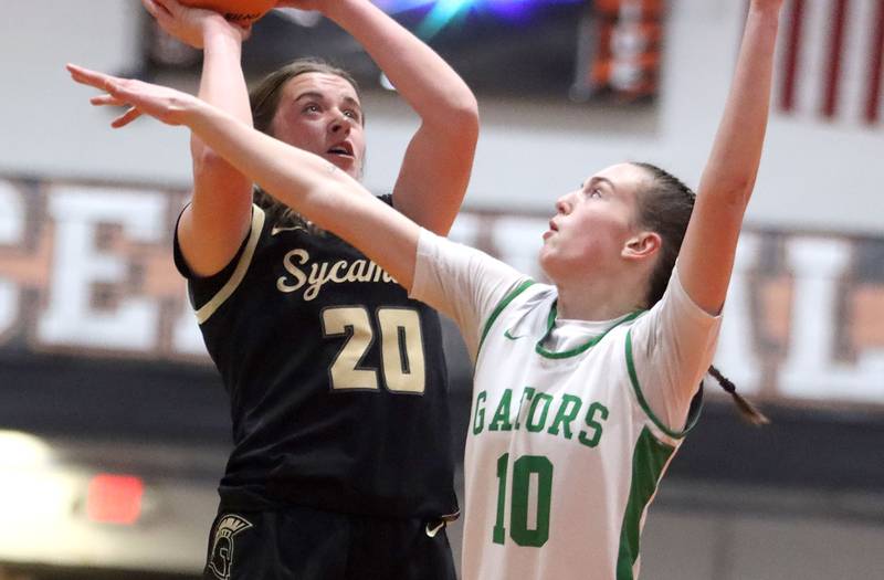 Crystal Lake South’s Mallory Glover, right, guards Sycamore’s Callie Countryman in girls IHSA Class 3A Sectional basketball on Tuesday, Feb. 24, 2026, at Crystal Lake Central High School in Crystal Lake.