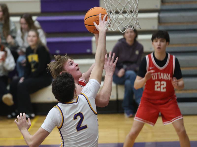 Mendota's Drew Becker blocks Ottawa's Owen Sanders shot on Tuesday, Jan. 6, 2026 at Mendota High School.