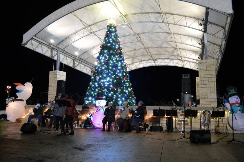 The Love Light Tree is lit up for the first time on Friday, Nov. 17, 2023, in RW&B Park in Rock Falls as part of the Hometown Holidays celebration.