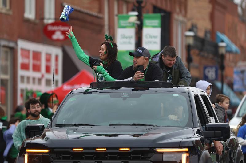 Members of Rob Barker Ford toss t-shirts to the crowd at the annual Plainfield Hometown Irish Parade on Sunday, March 15, 2026 in Plainfield.