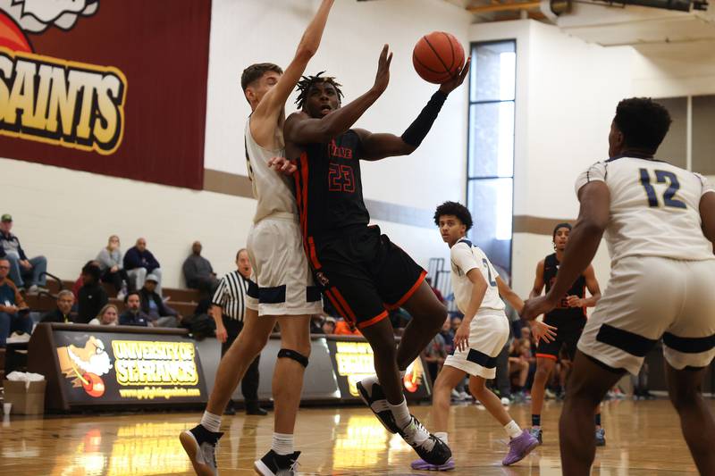 Romeoville’s Denonte Cunningham goes in for the basket against Lemont in the WJOL Thanksgiving Classic Championship in Joliet on Saturday.