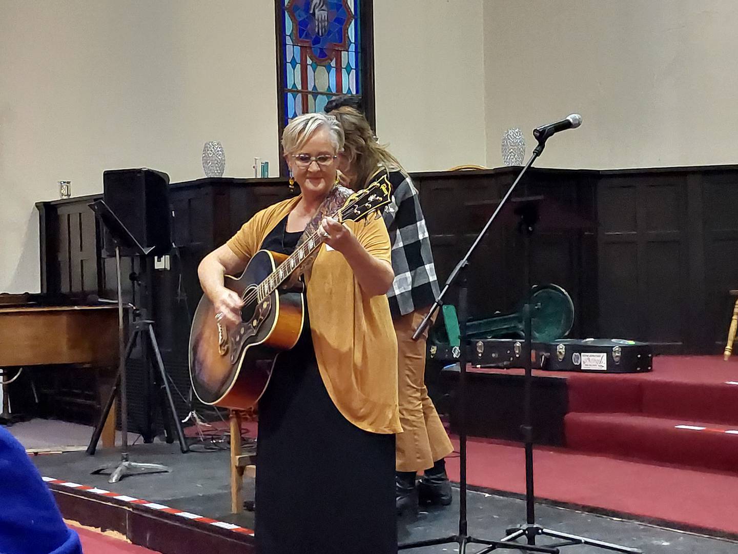 Katie Trupiano performs on guitar Thursday, Sept. 28, 2023, during a reception celebrating the creation of the Ottawa Center for the Arts.