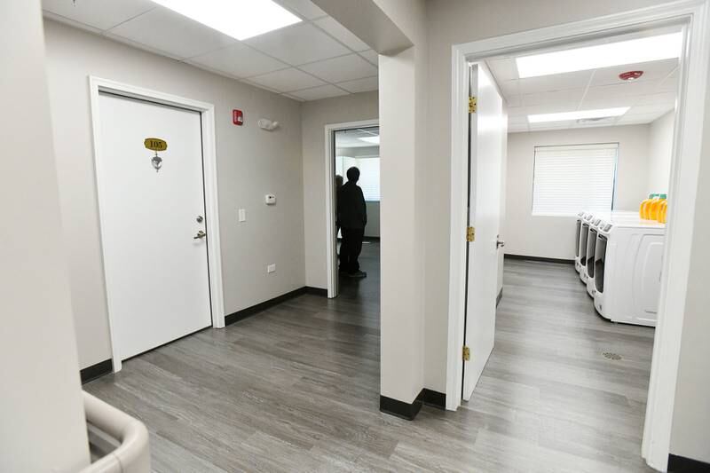 Attendees tour the new housing for homeless veterans, Liberty Lodge during an open house Monday at the 210 S. Washington Ave. property in Kankakee.