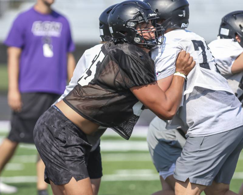 Aiden Solecki goes through pass rushing drills at Downers Grove North High School football practice, Thursday, Aug 14, 2025  in Downers Grove.