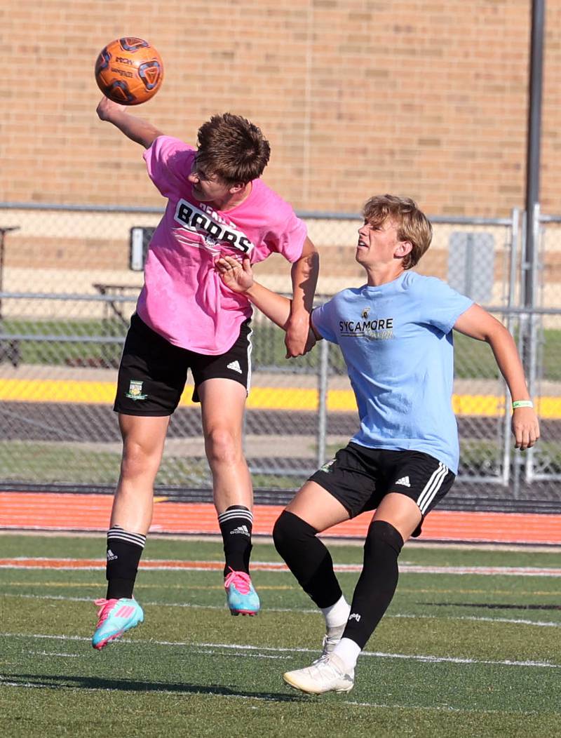 DeKalb’s Jack McCormick heads the ball in front of a Sycamore player Monday, July 14, 2025, during a summer boys soccer friendly at DeKalb High School.