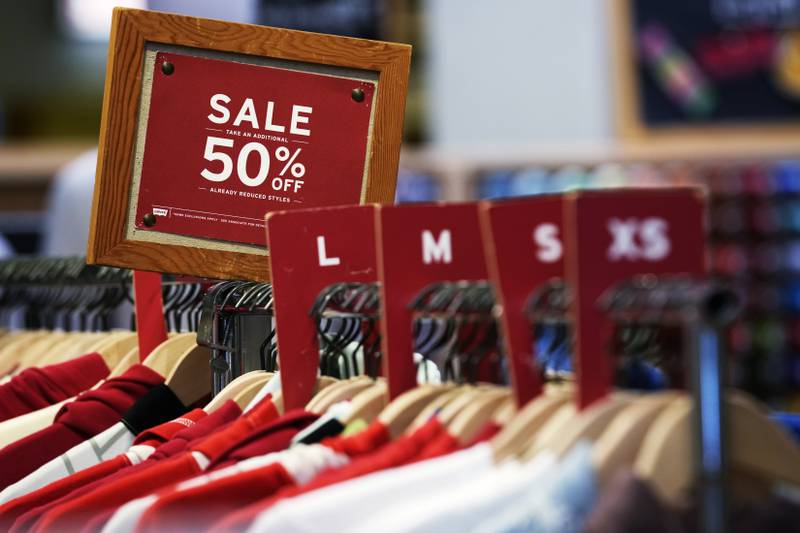 FILE - A sale sign is displayed on a rack of clothes at a store in Chicago, Monday, June 10, 2024. (AP Photo/Nam Y. Huh, File)