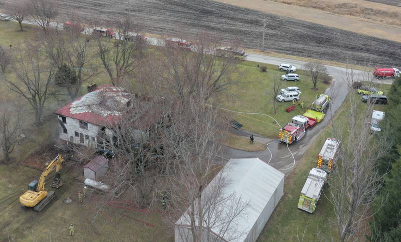 Firefighters work the scene of a structure fire on North 43rd road about a half mile west of the East 1st road intersection on Thursday, Jan. 2, 2024 in Mendota.