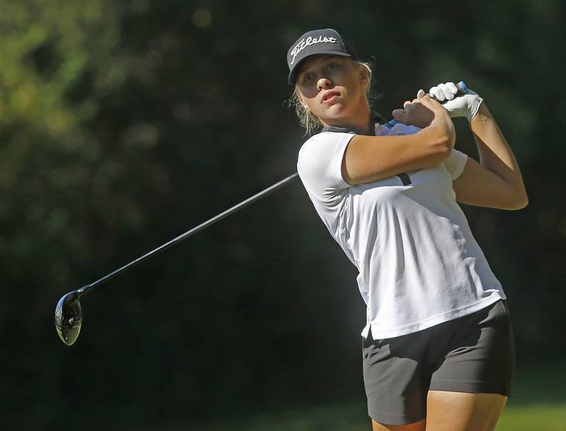 Jacobs’ Natalie Zimmerman watches her tee shot on the 5th hole during the Fox Valley Conference Girls Golf Tournament Wednesday, Sept. 25, 2024, at Crystal Woods Golf Club in Woodstock.