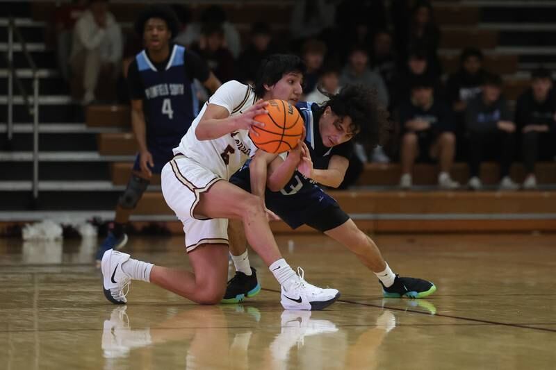 Morris’ Luis Loza fights off Plainfield South’s Joell Tunnat on Wednesday, Jan 29, 2025 in Morris.