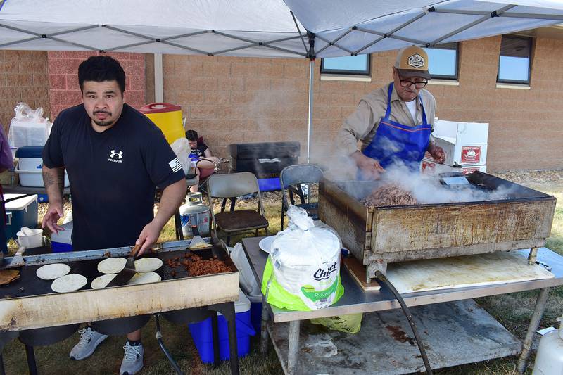 Raul Sanches Jr (left) and Juan Trujillo of Sterling work the Shorty's Tacos booth, Saturday, Sept. 13, 2025, at Taste of Fiesta in Rock Falls.