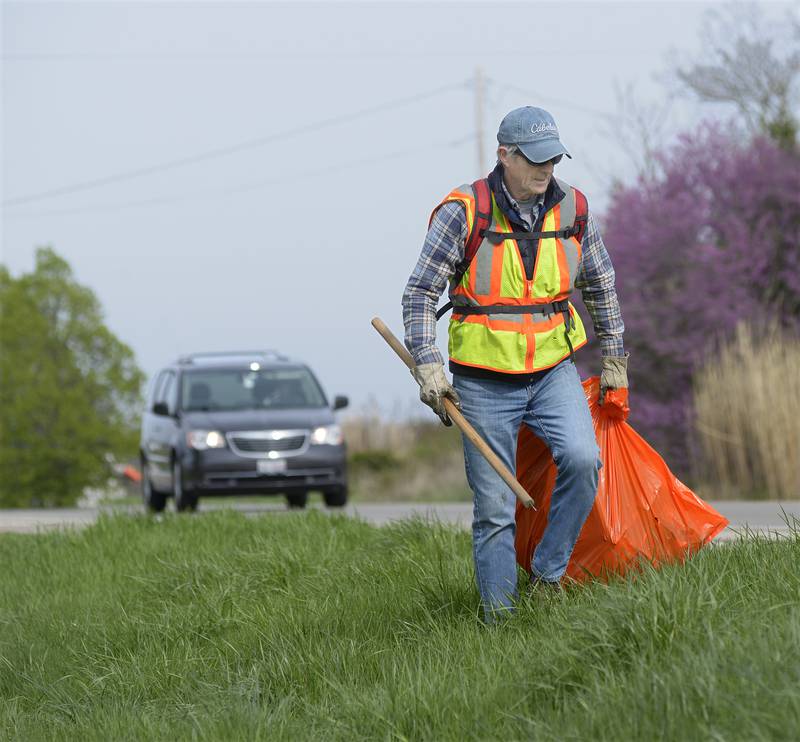 Celebrating Earth Day, Steve Harmon was on of the 30 volunteers participating in Operation Clean Sweep by picking up trash along RT 6 west of Ottawa Monday. The volunteers cleanup for 3 hours on the north and south sides of RT 6.