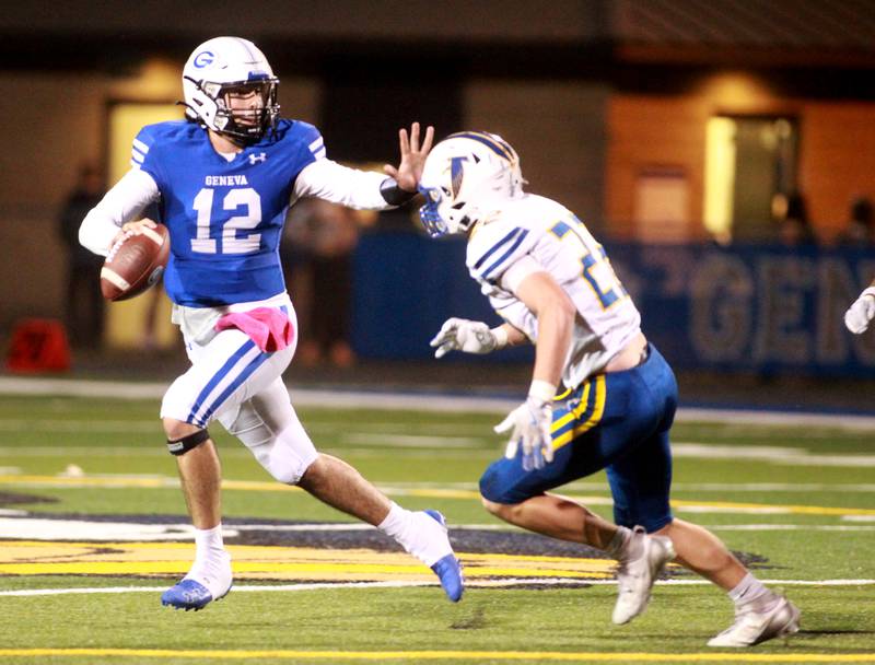 Geneva quarterback Anthony Chahino blocks Wheaton North’s Alex Karlovitz during a game on Friday, Oct. 11, 2024 at Geneva.