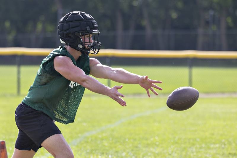 Rock Falls’ Trail Stonitsch pitches the ball Tuesday, August 12, 2025. The team hit the gridiron for day two of practices ahead of the 2025 season.