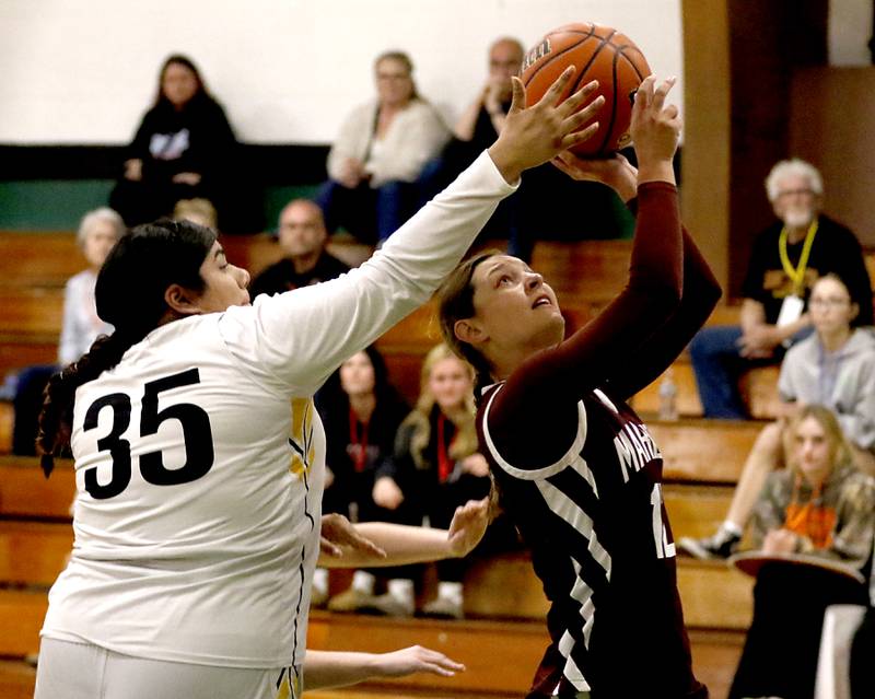 Harvard’s Gisselle Albarran tries to block the shot of Marengo's Gabby Gieseke during the girl’s game of McHenry County Area All-Star Basketball Extravaganza on Sunday, April 13, 2025, at Alden-Hebron’s Tigard Gymnasium in Hebron.