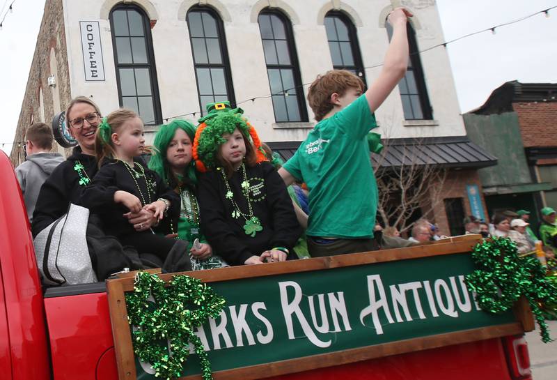 The Clarks Run Antiques float travels along Mill Street for the St. Patrick's Day parade on Saturday, March 15, 2025 downtown Utica.
