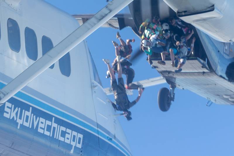 Divers jump out of plane in attempt of the beating state record of most jumpers in formation on Wednesday, Aug 20, 2025 above Skydive Chicago in Ottawa.