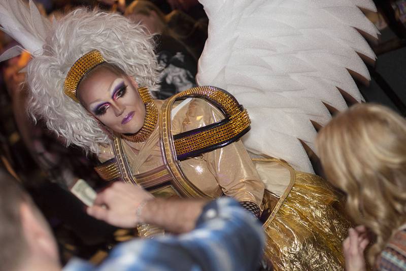 Donning giant white wings, Sharon ShareAlike collects tips as she makes her way through the audience in an April 10, 2022 file photo. She is hosting a drag show Saturday at the Dixon VFW that will donate a portion of the proceeds to Dixon Pride.