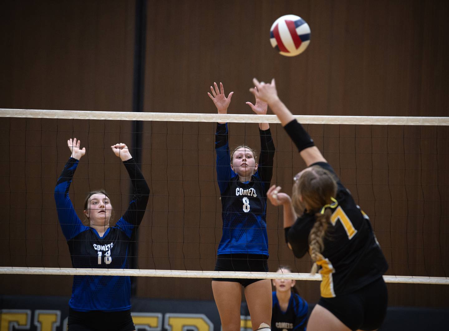 Clifton Central's Maddie Webb, left, and Payton Lamie, center, look to block a hit from Herscher's Addie Wilkins, right, in a match on Monday, September 29, 2025.