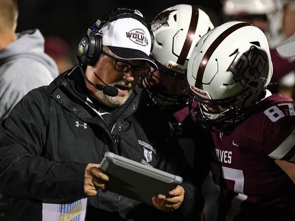 Prairie Ridge coach Chris Schremp learns of IHSFCA Hall of Fame induction just hours before surgery