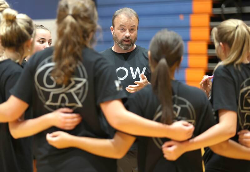 Genoa-Kingston head volleyball coach Keith Foster talks to his team Tuesday, Aug. 23, 2022, during practice at the school in Genoa.