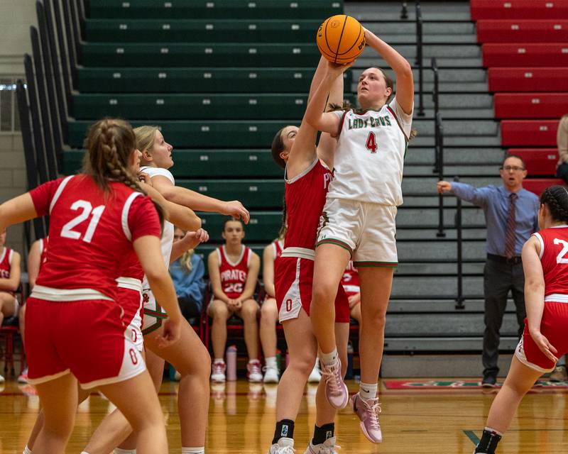Alexus Hines (4) of LaSalle-Peru pulls up for midrange shot as Aubrey Sullivan (33) of Ottawa attempts to deflect on Wednesday, December 17, 2025 at Sellet Gymnasium in LaSalle.