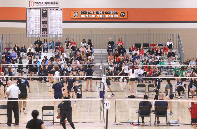 Players compete in front of a good crowd in the field house Friday, May 12, 2023, during the IHSA State Badminton Finals at DeKalb High School.