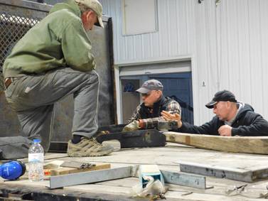 Lanark First Brethren and friends help repair truck for Fellowship of Christian Farmers International