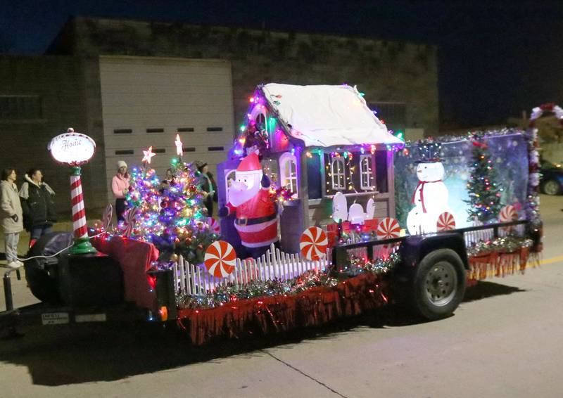A Santa float rolls down Peoria Street during the Light up the Night parade on Saturday, Dec. 3, 2022 downtown Peru.