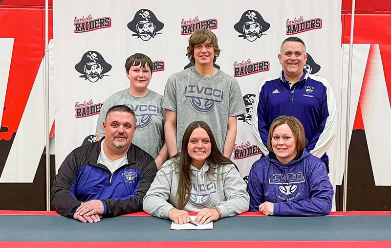 Earlville senior Elizabeth Browder (seated, center) signed to play basketball at IVCC. She was joined by her parents (seated) Adam and Carrie Browder, and (standing left to right) brothers Aaden and Ryan and IVCC coach Josh Nauman. Browder averaged 14.8 points and 10 rebounds as a senior. She finished as Earlville's all-time leading scorer and was unanimous All-Little Ten Conference.