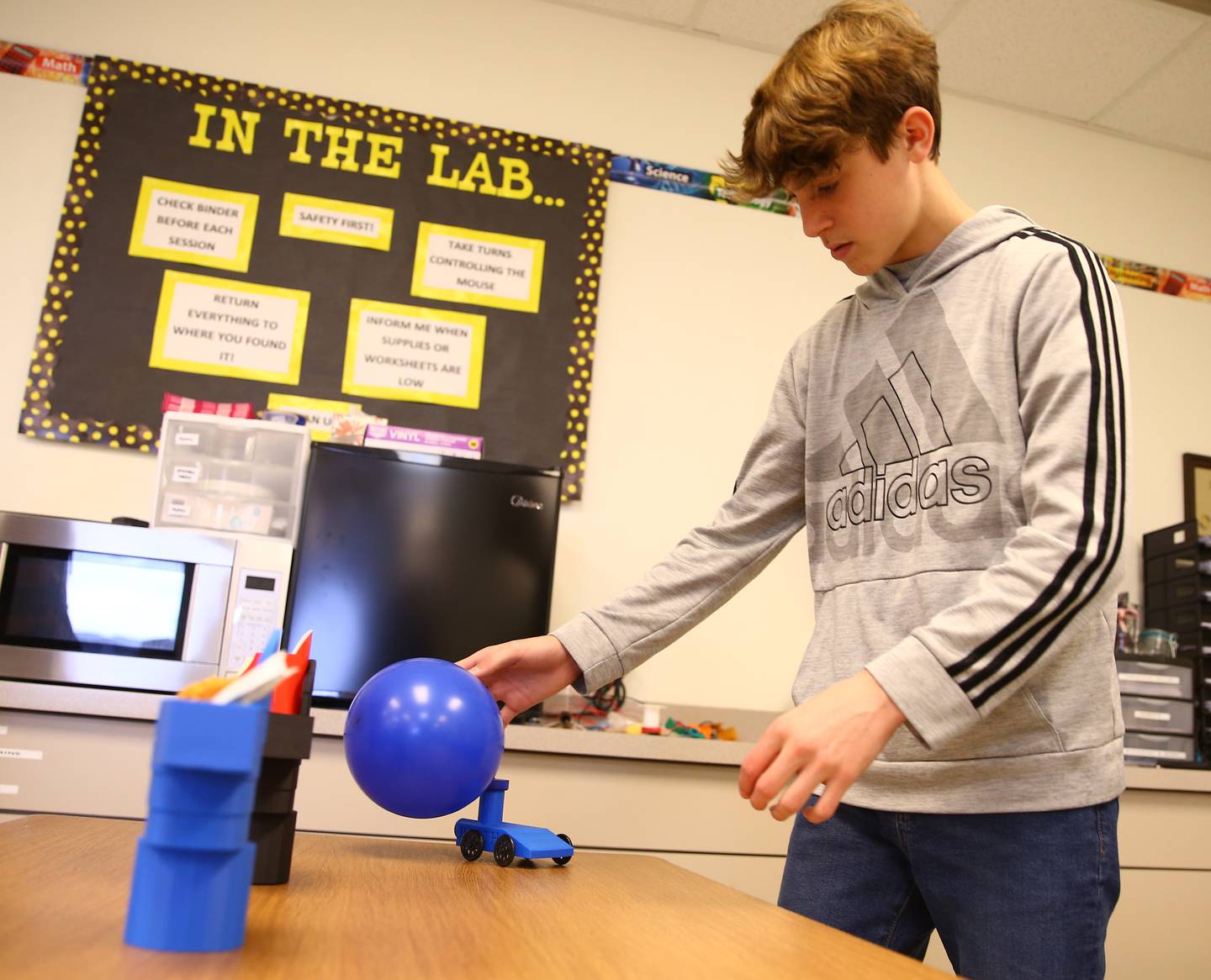 Joey Libhart, a student at Wallace Grade School, demonstrates how he made a balloon that self-propels using a balloon on Thursday, April 7, 2022 in Wallace. Libhart, made the car using a 3D printer.