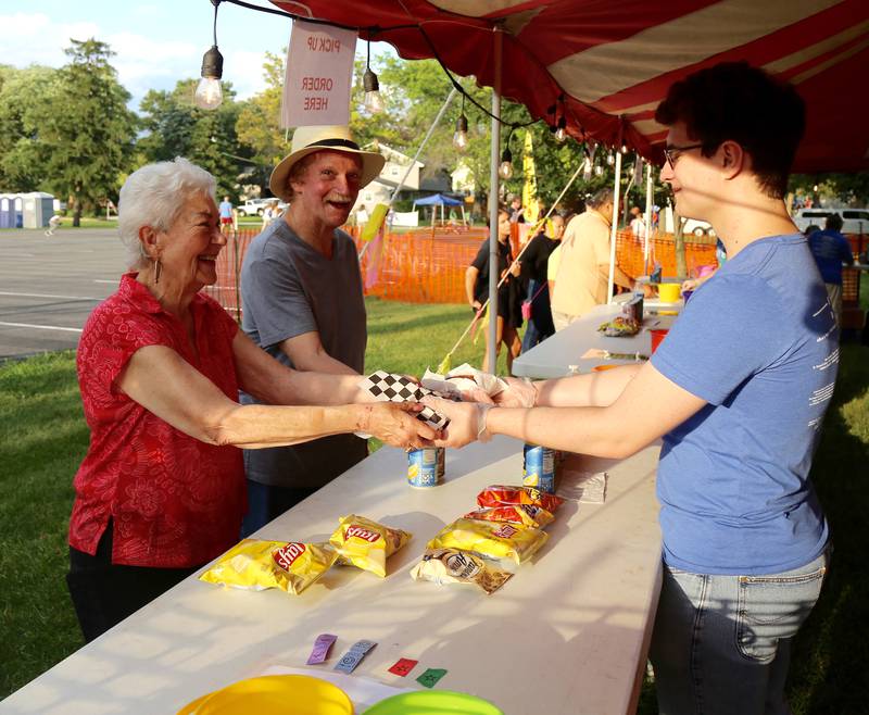 Roz Wirtz and Robert Carter get food before the fireworks show starts on Saturday, July 12, 2025 in Elburn.
