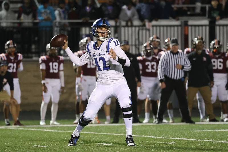 St. Charles North's J.T. Padron passes against Brother Rice in the third round of the playoffs on Saturday, Nov. 15, 2025 in Chicago.