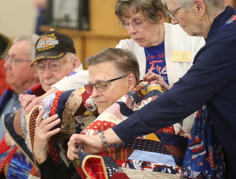 Veteran Richard Brown receives his quilt during the Quilt of Valor ceremony on Saturday, April 19, 2025 at the Moose Lodge in Princeton.
