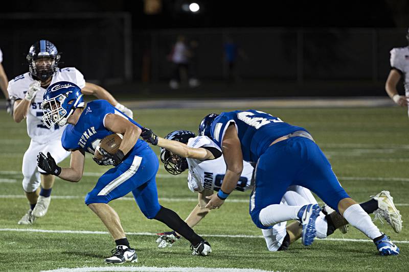 Newman’s Brady Grennan works to get away from Bureau Valley’s James Etheridge Friday, Sept. 29, 2023 in Sterling.